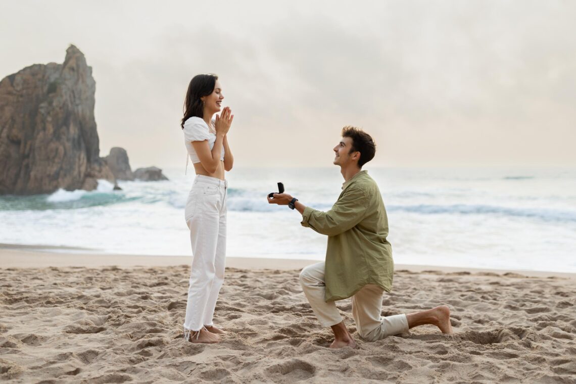 romantic proposal seashore loving young man with engagement ring making proposal happy